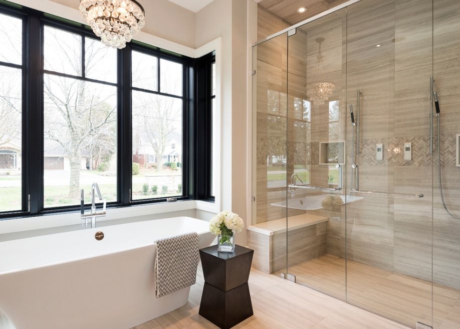 A bathroom with a bathtub and a walk in shower.