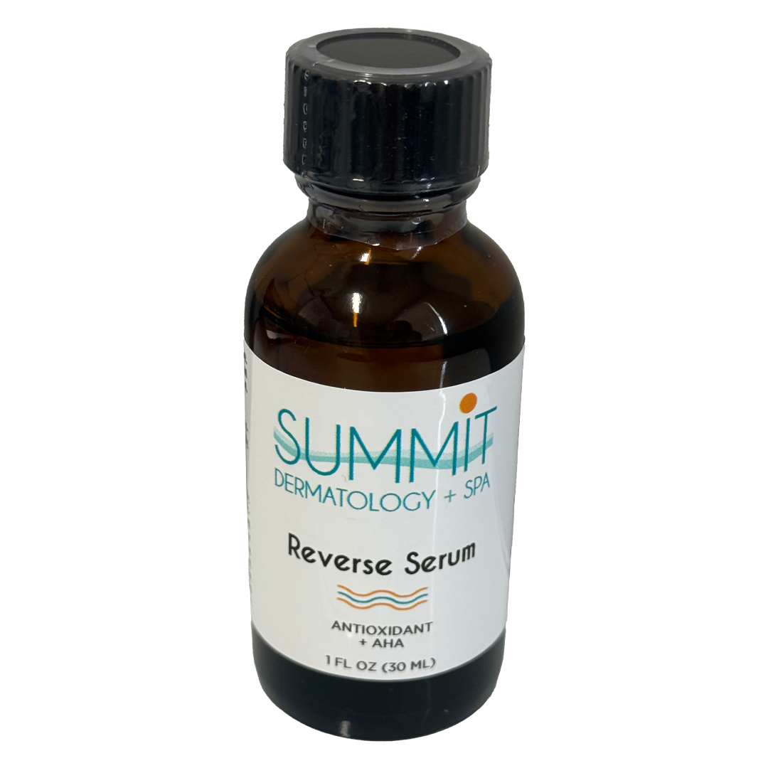 A bottle of summit dermatology reverse serum on a white background.