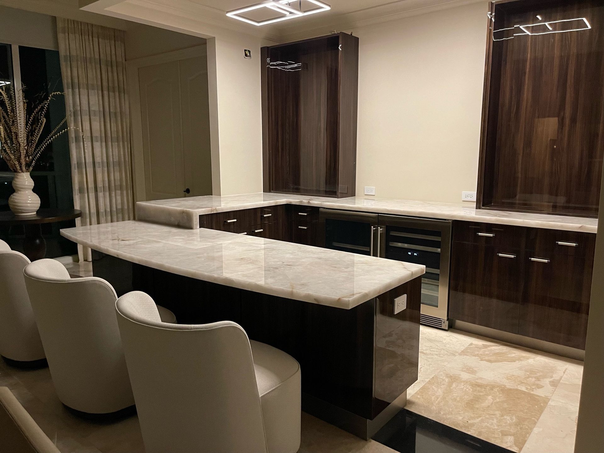 There is a large island in the middle of the kitchen.