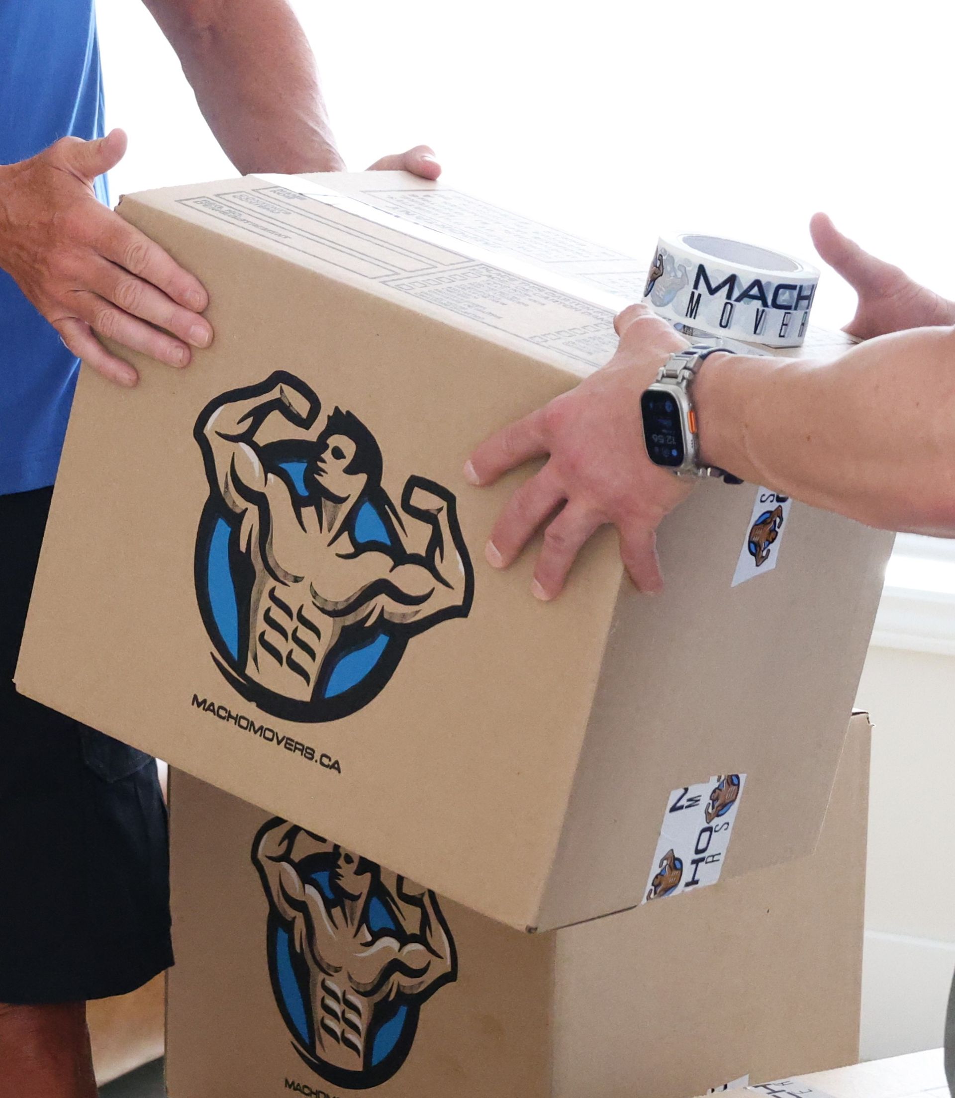 a woman is putting a label on a cardboard box .