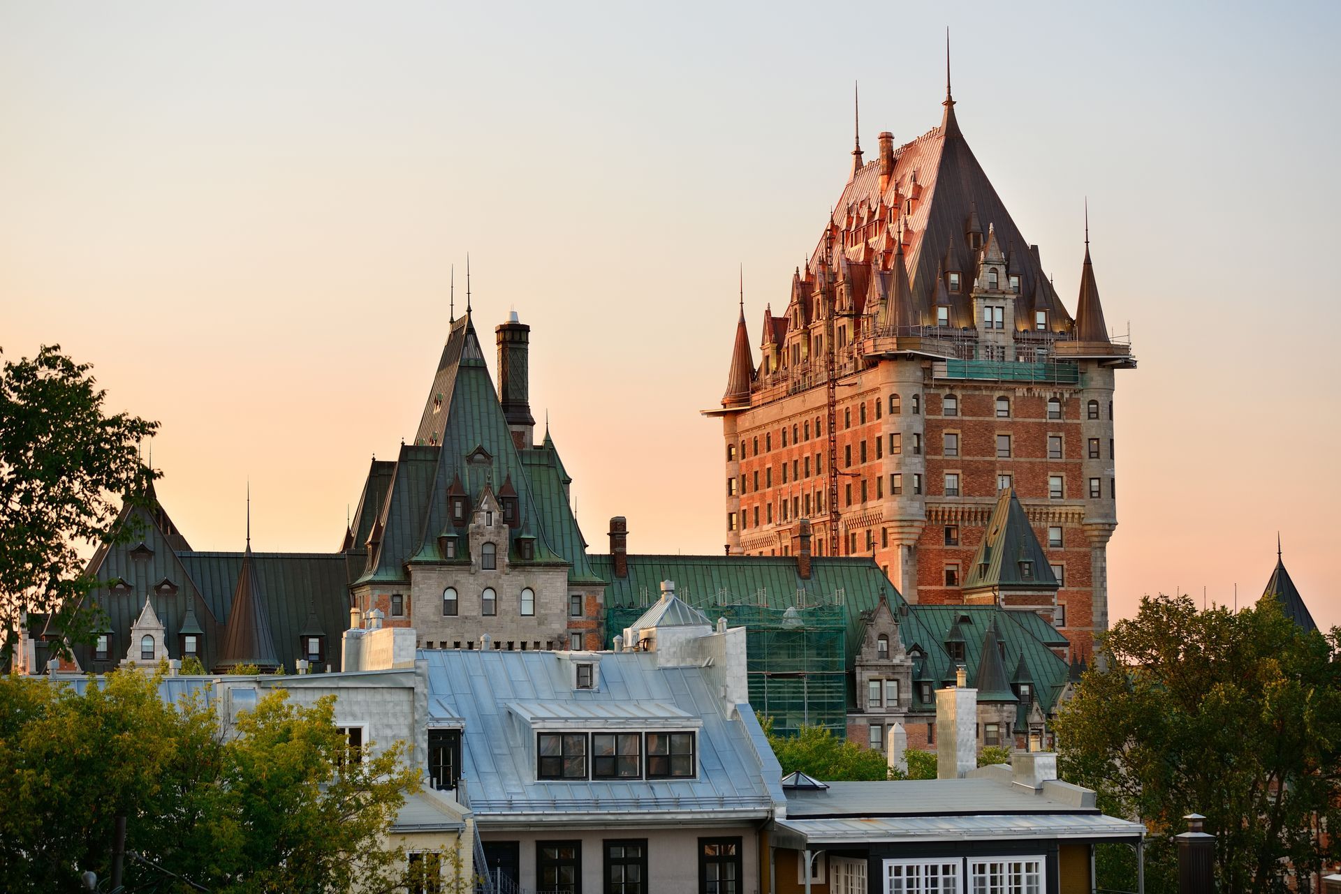 A large building with a castle in the background