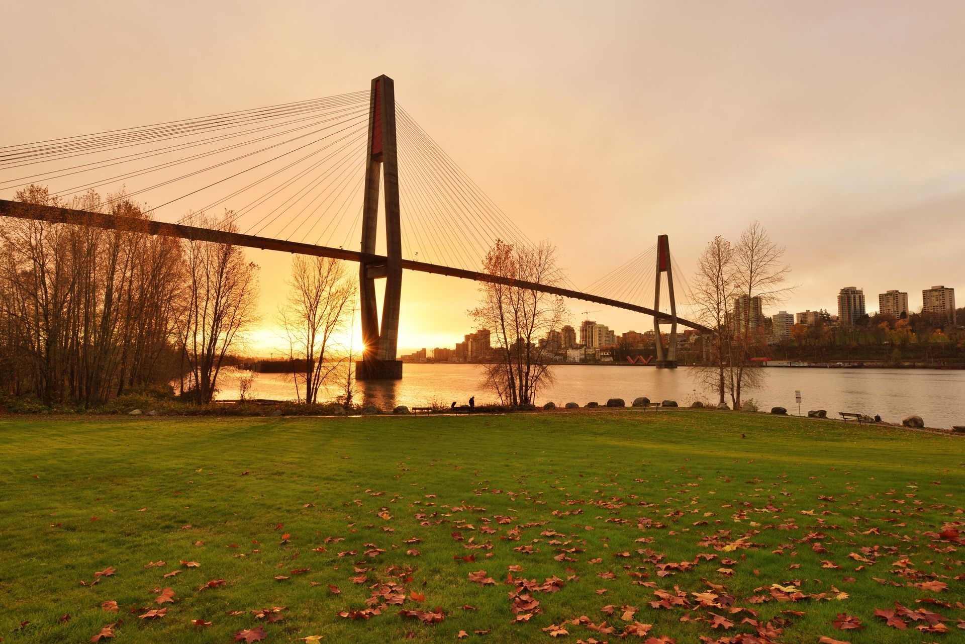 A bridge over a body of water at sunset