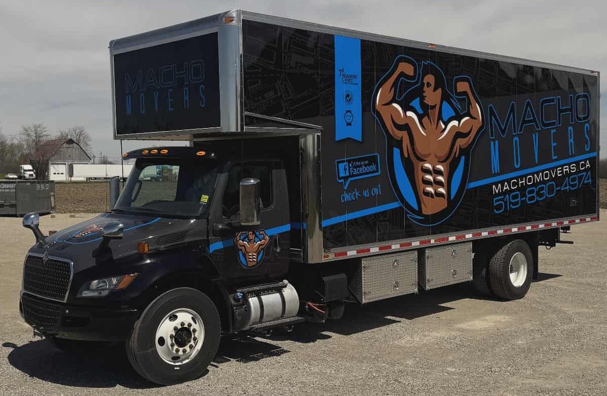 a man is carrying a rug and giving a thumbs up .