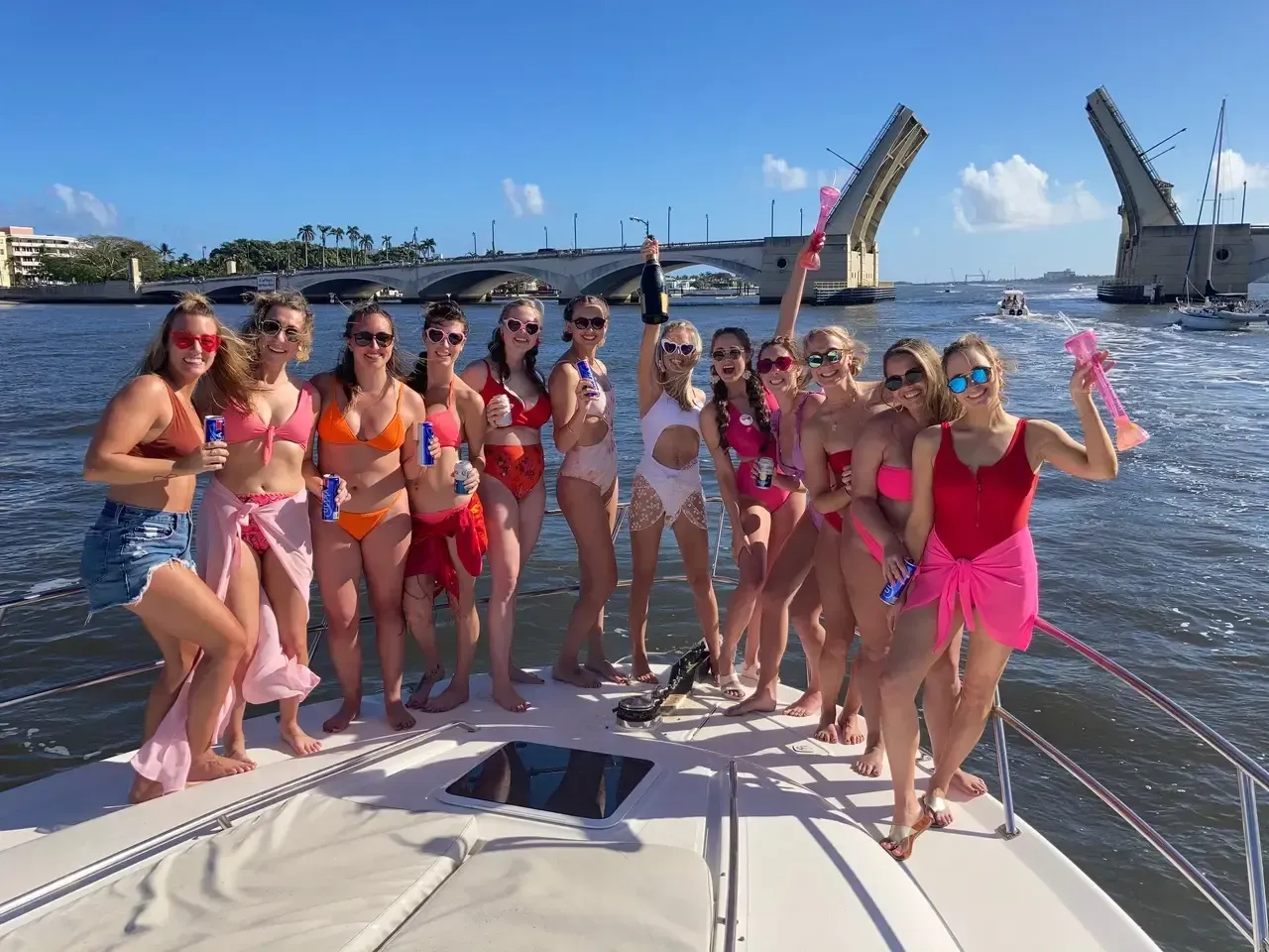 Bachelorette girls enjoying sunshine on yacht bow