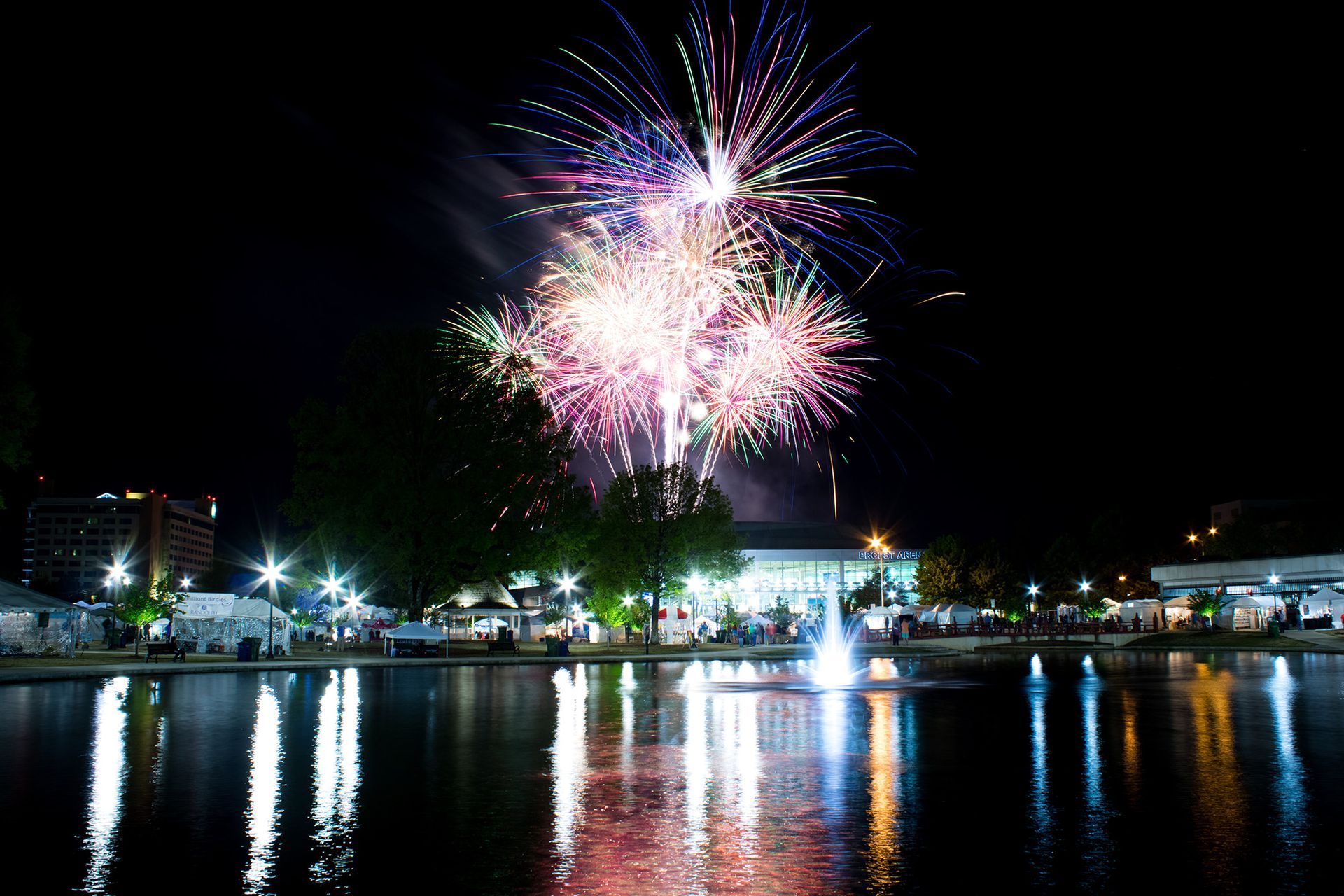 A fireworks display over a body of water