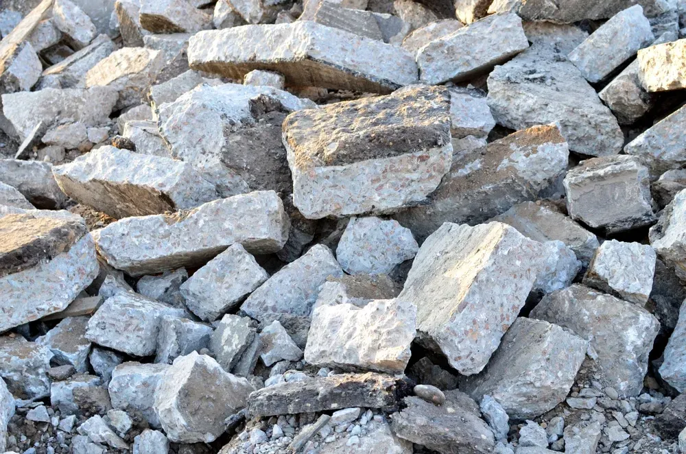 Pile of rough gray rocks and gravel stacked together outdoors — Coastal Sand Soil & Mulch in Fraser Coast, QLD