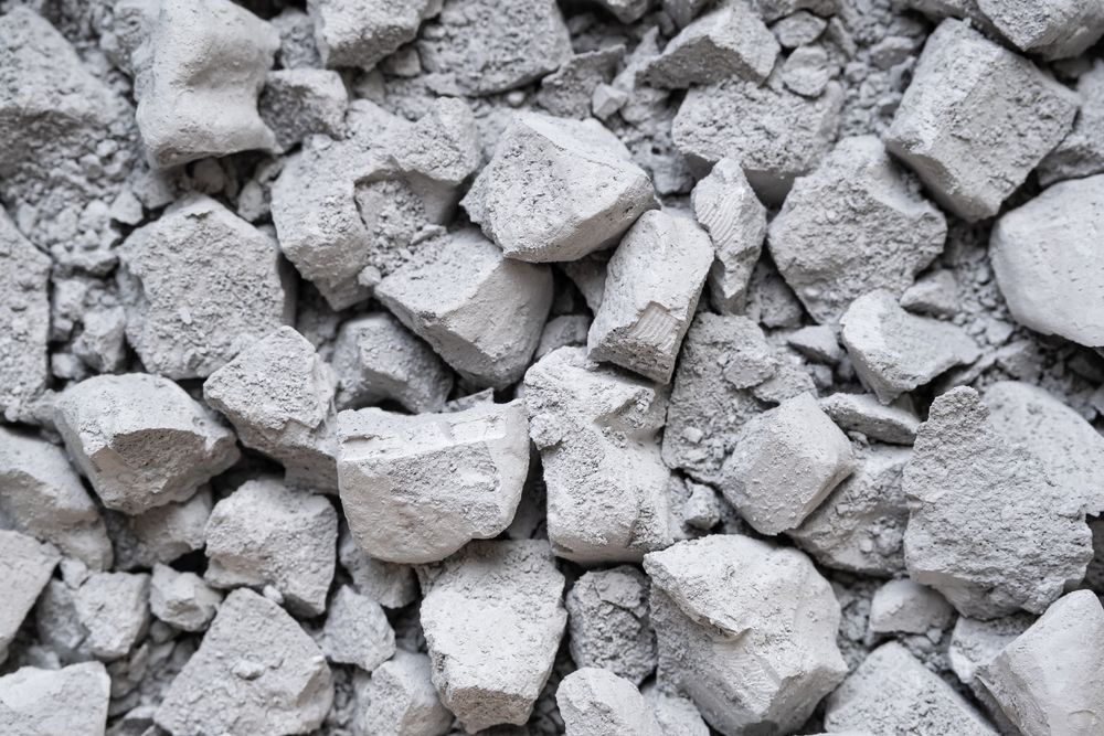 Pile Of Light Gray Broken Concrete Rubble and Stones — Coastal Sand Soil & Mulch in Burrum Heads, QLD