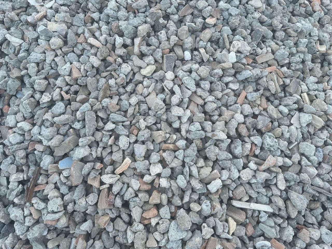Close-up Of Small Gray Gravel Stones Filling the Frame — Coastal Sand Soil & Mulch Craignish, QLD