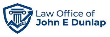 Blue shield law office logo with scales of justice and text “Law Office of John E Dunlap”