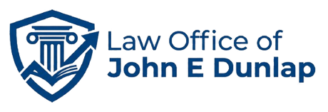 Blue shield law office logo with scales of justice and text “Law Office of John E Dunlap”