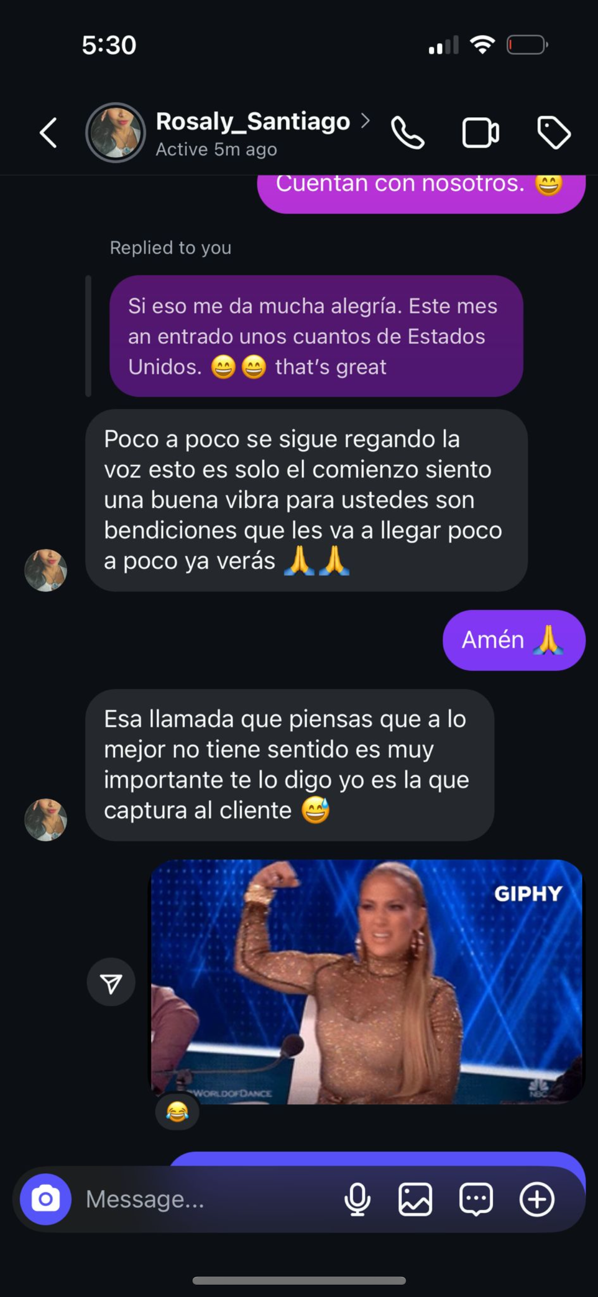 Dark-mode chat screenshot with purple and gray message bubbles, including a reaction GIF of a cheering man on TV.