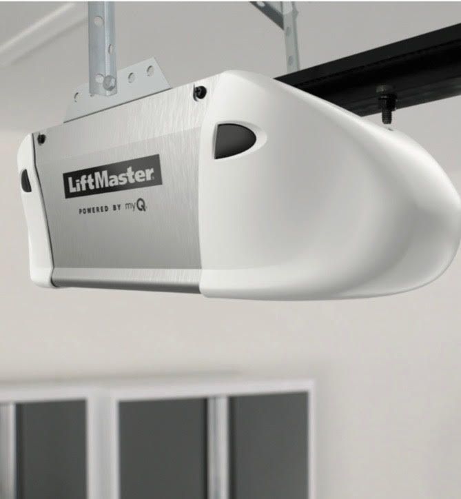 White and silver LiftMaster garage door opener, mounted on a ceiling.