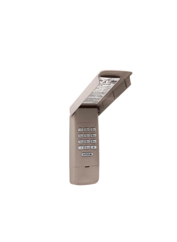 Beige garage door keypad with the lid open, revealing a keypad.