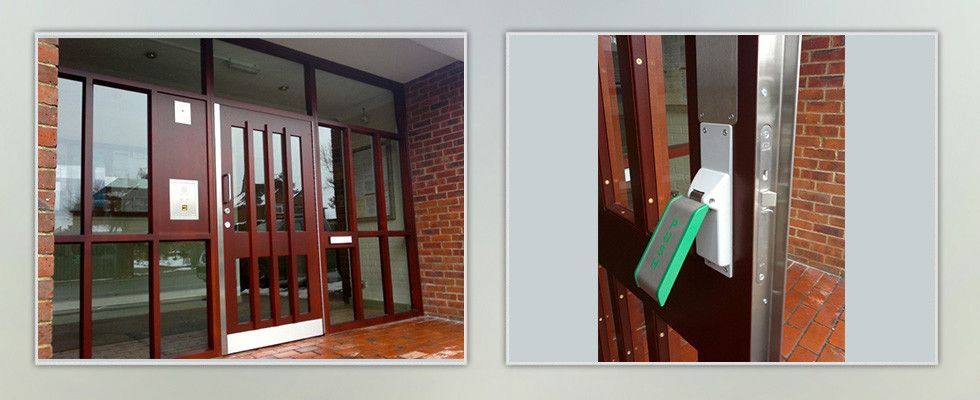 a picture of a door with a green button on it