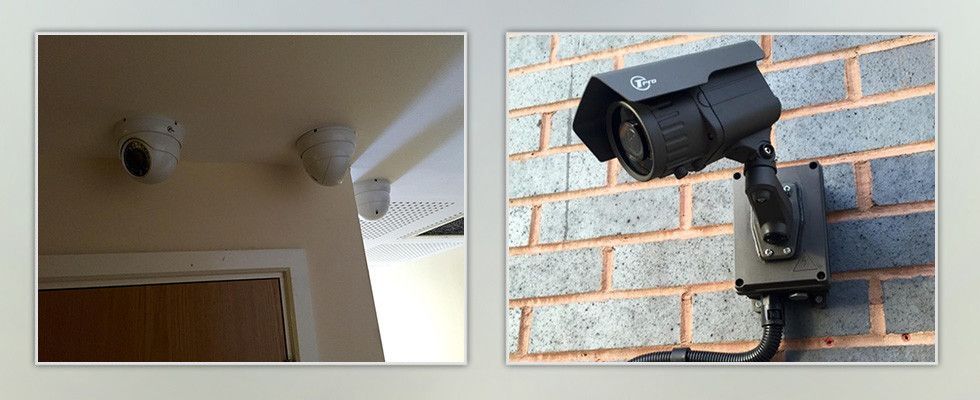a picture of a security camera on a brick wall