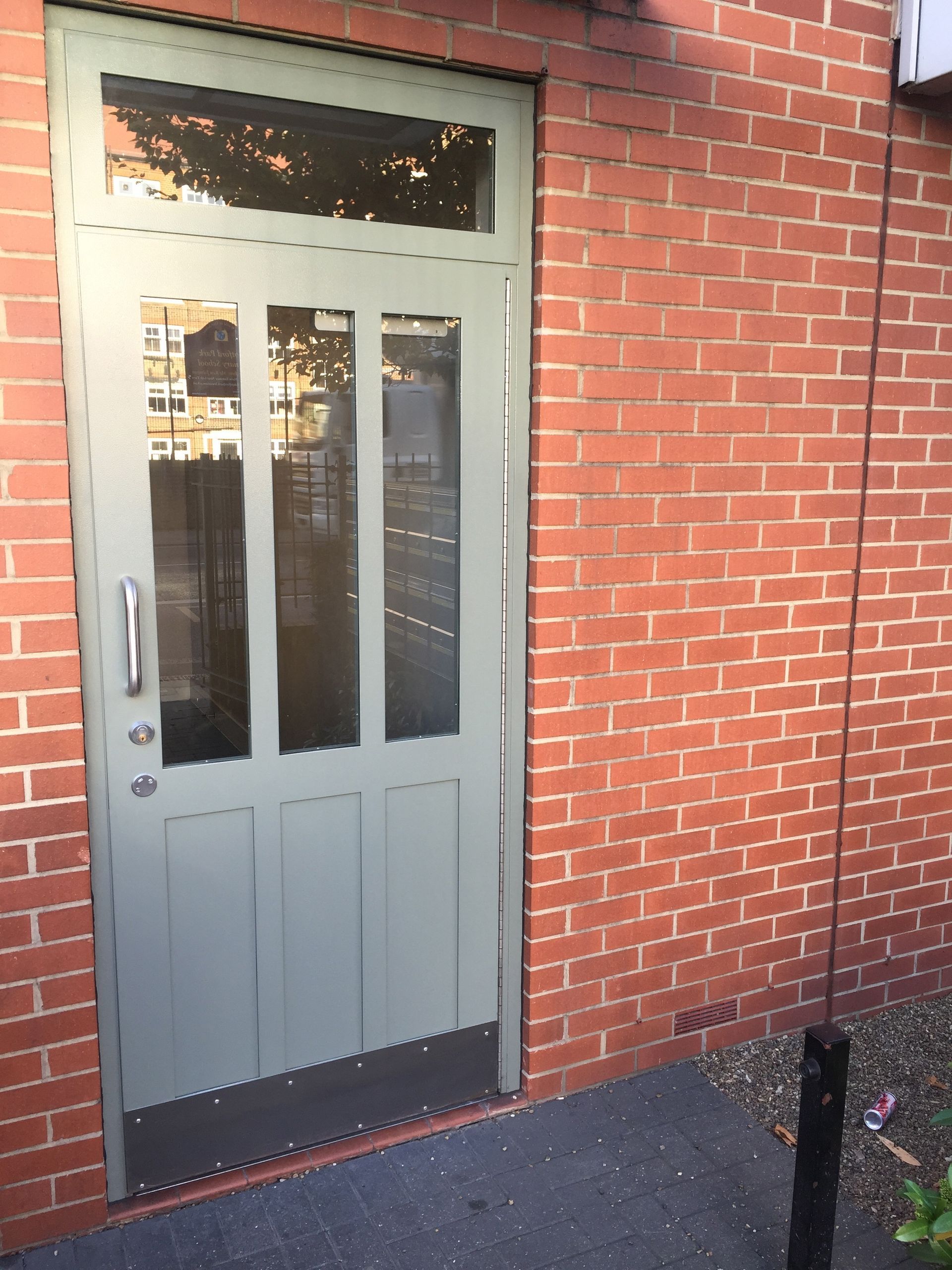 a brick building with a door that says ' a ' on it