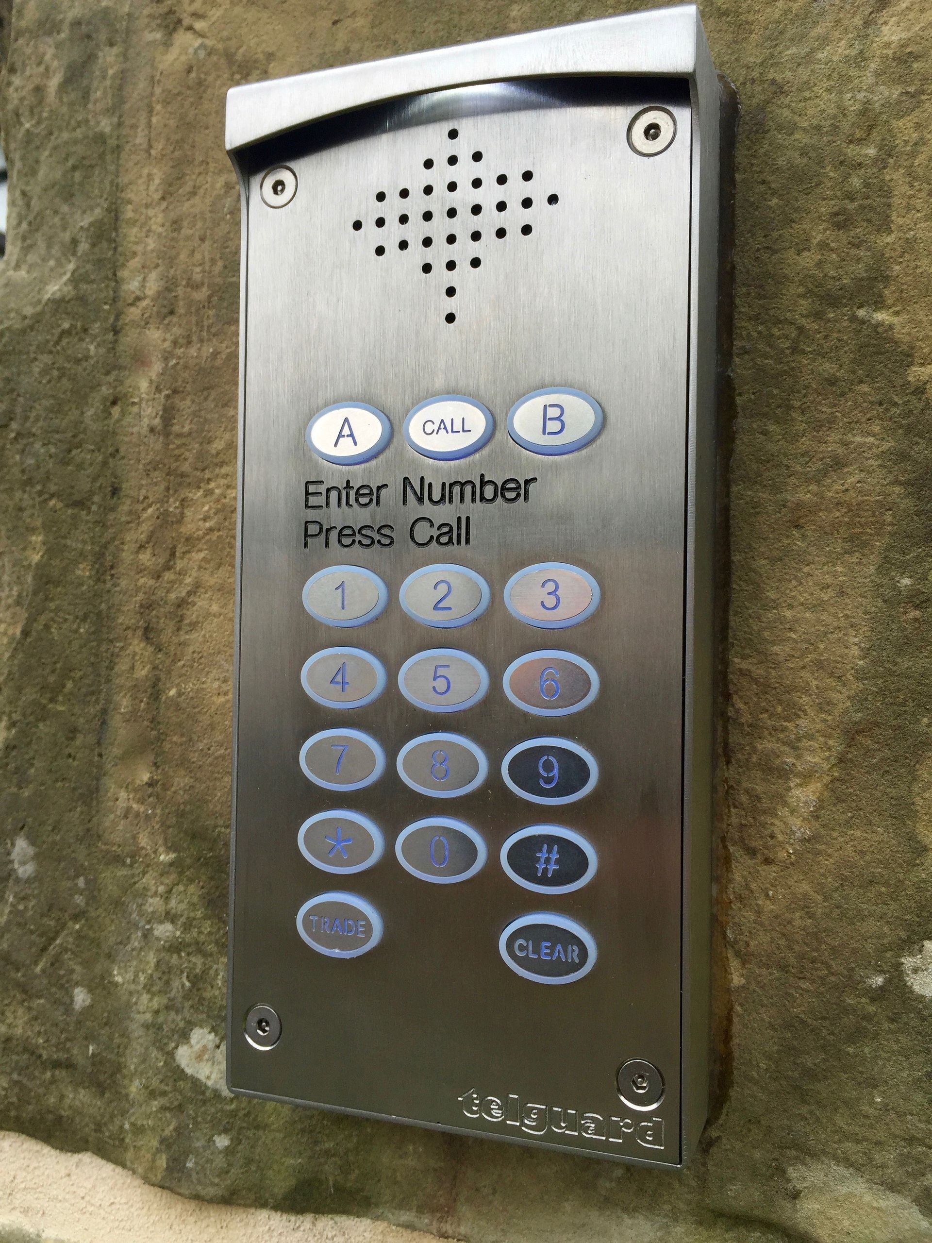 a stainless steel keypad that says enter number press call