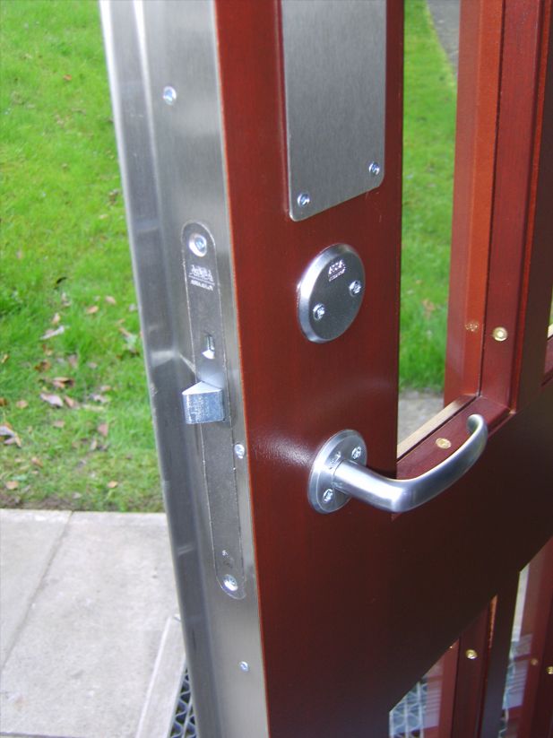 a close up of a door with a lock that says assa