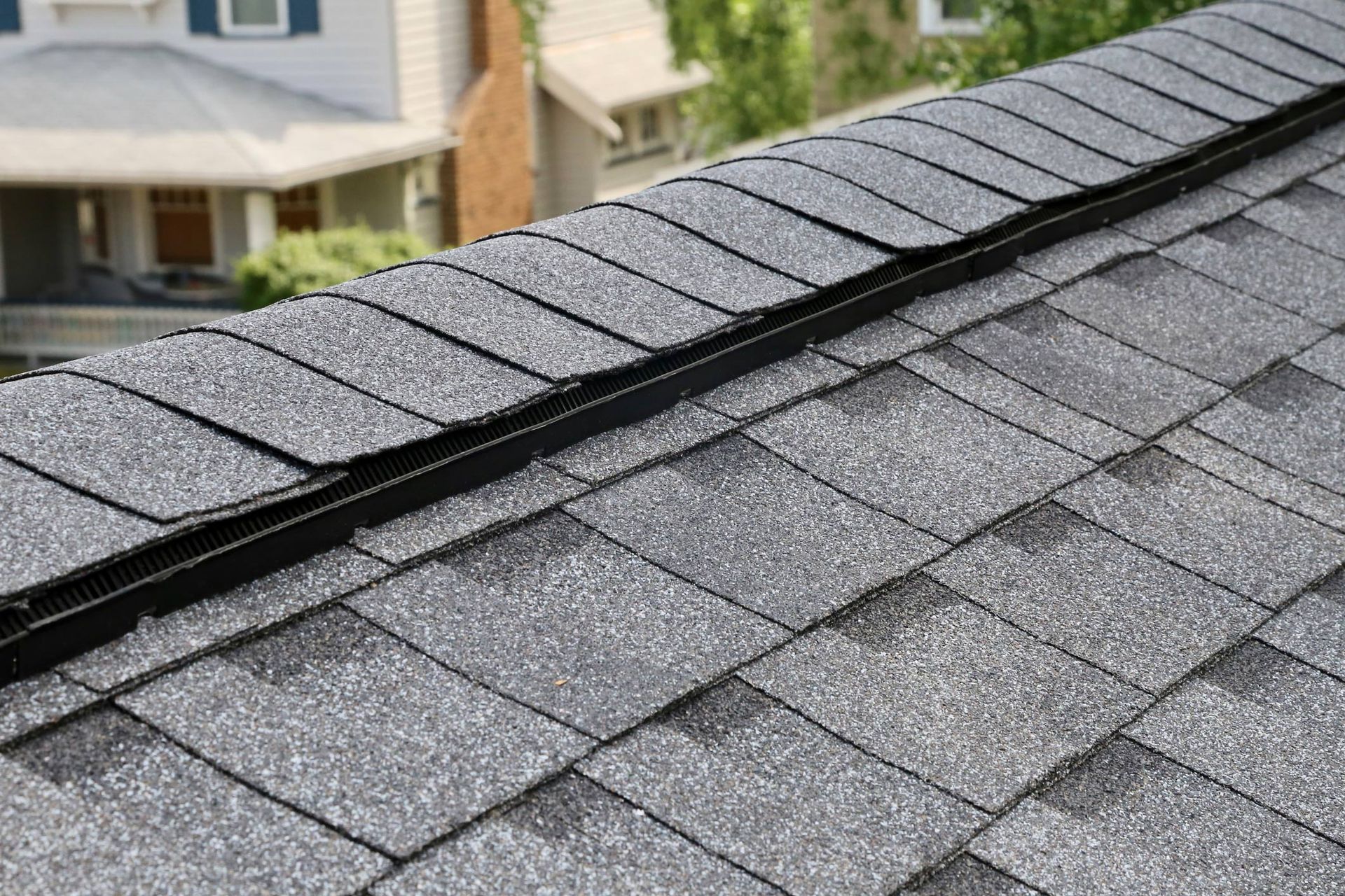 Roof with a House — Rochester, MN  — Joe Tlougan Roofing Inc.