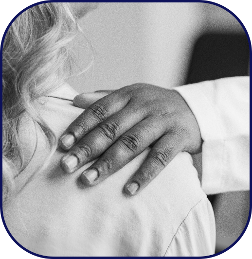 A mentor's hand on mentee's shoulder to symbolize authentic guidance and supervision