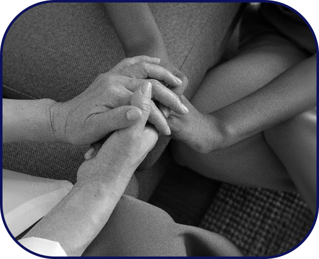 A teen confiding in a therapist as they hold hands