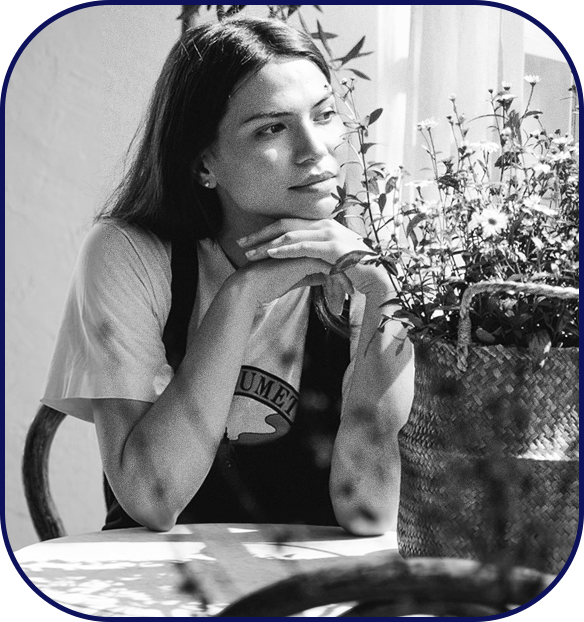A young woman sitting alone and thinking deeply