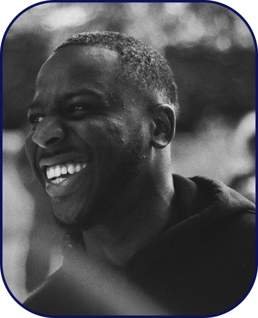 Man genuinely laughing while outdoors