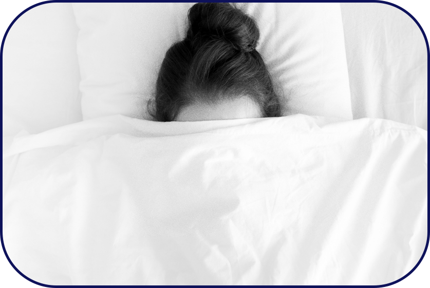 Person staying in bed under blanket