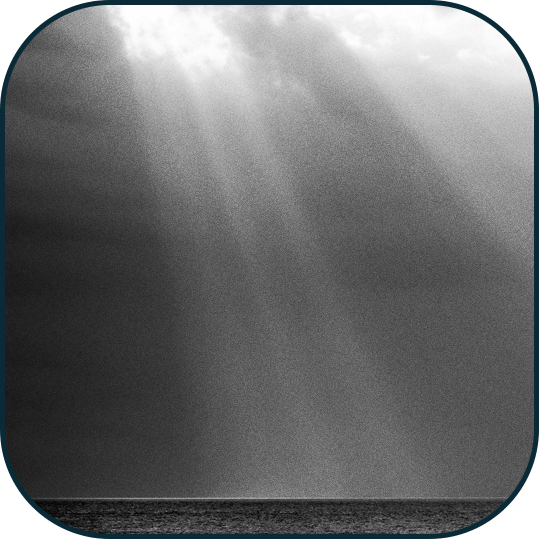 Rays of light shining through clouds to represent overcoming depression