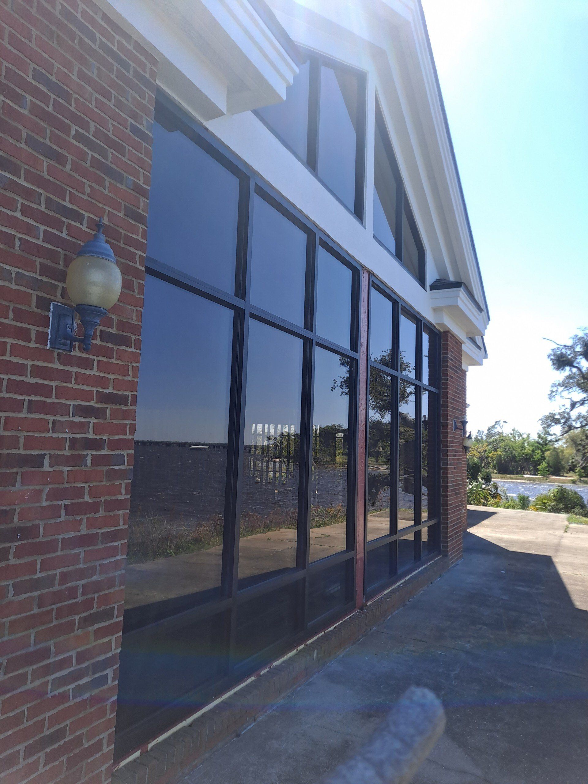brick building with dark metal and glass storefront