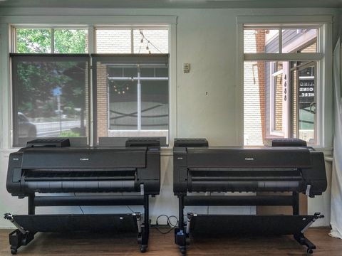 a picture of 2 large format inkjet printers.