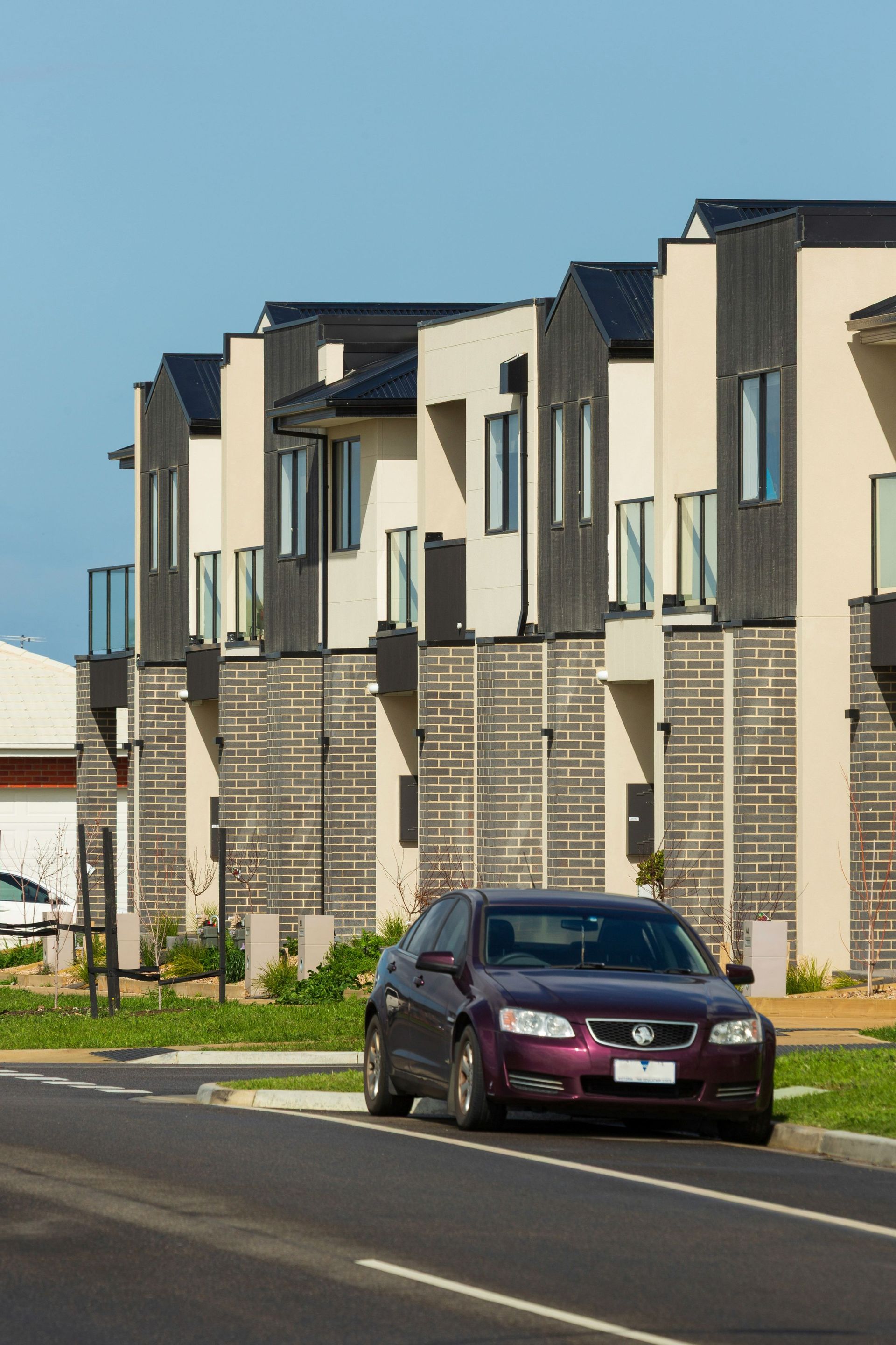 Modern townhouses in an Australian suburban estate similar to Springfield Lakes QLD