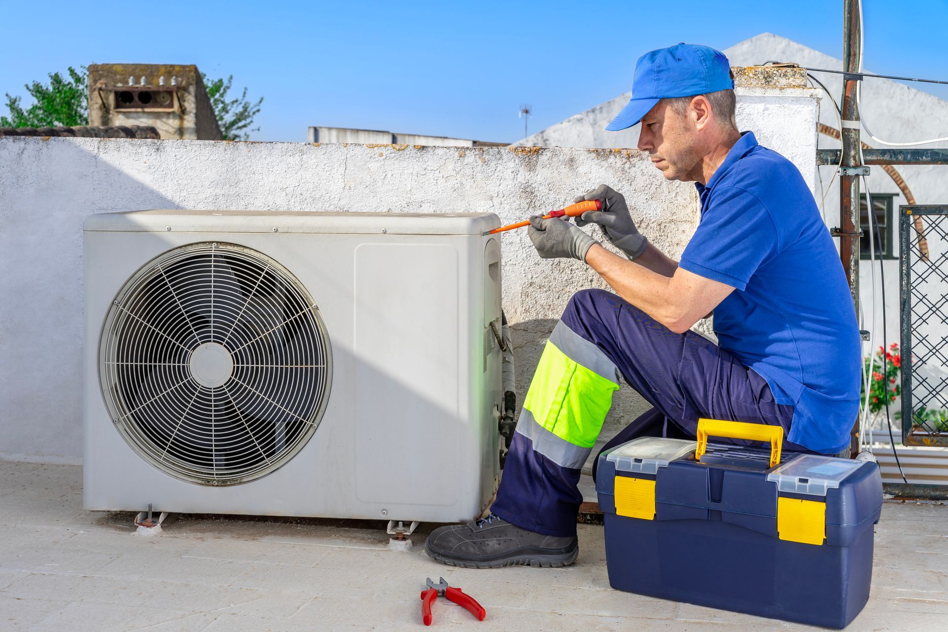 Houston Admiral Technician inspecting heat pump with frozen coils, refrigerant leak in Tomball home.