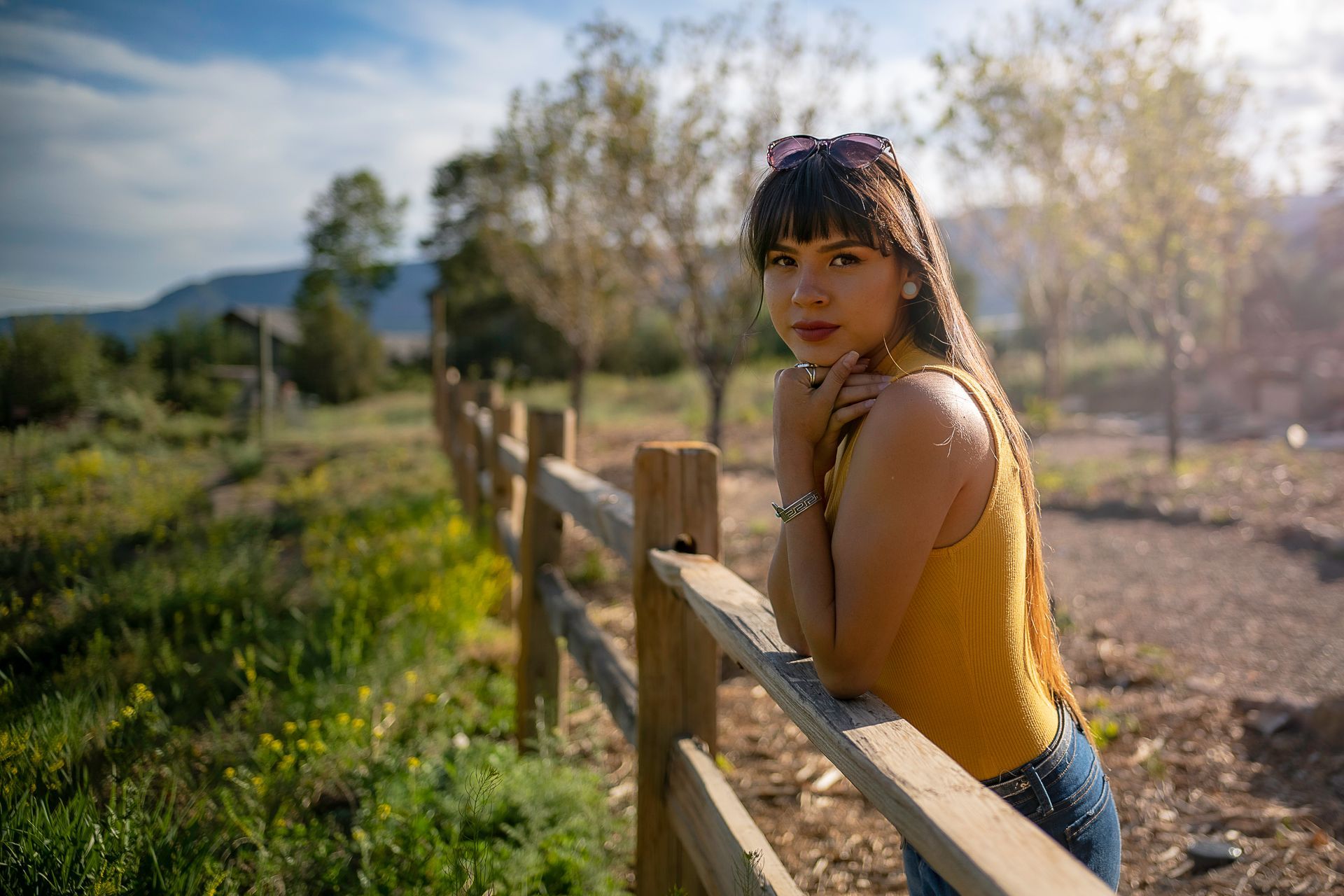 Outdoor portrait session on a ranch fence near Durango, Colorado by Aelpha Collective