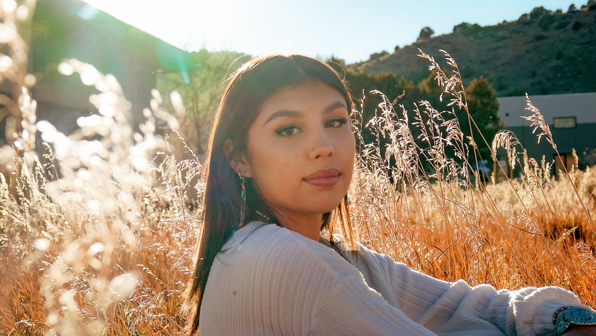 Senior portrait in a golden meadow near Durango, Colorado by Aelpha Collective