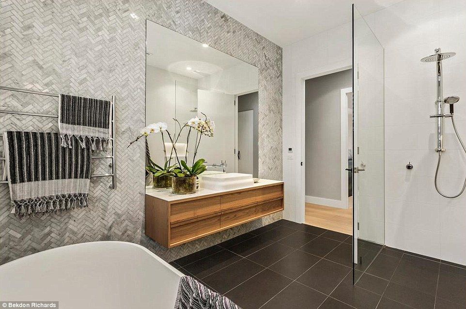 A Bathroom With Marble Tiles, A Walk In Shower, A Sink And A Mirror — Ultimate Bathrooms Ballarat In Alfredton, VIC