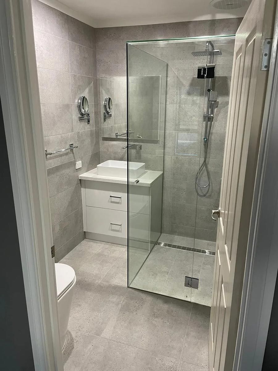 A Bathroom With A Walk In Shower , Sink, Toilet And Mirror — Ultimate Bathrooms Ballarat In Alfredton, VIC