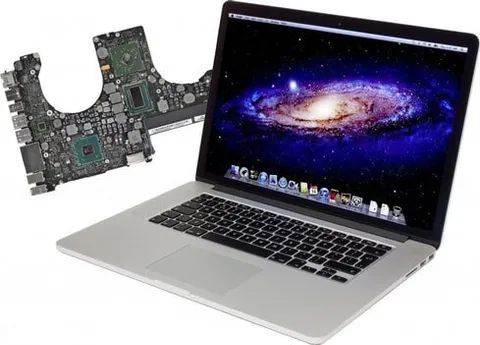 A Laptop With A Galaxy On The Screen Next To A Motherboard A Laptop With A Galaxy On The Screen Next To A Motherboard