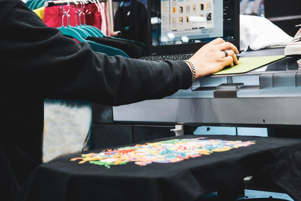 Person Printing a Shirt Using a Computer — Uniforms2U in Leumeah, NSW