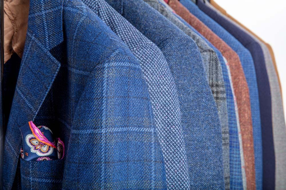 Blue Suits Hanging on a Rack — Uniforms2U in Campbelltown, NSW