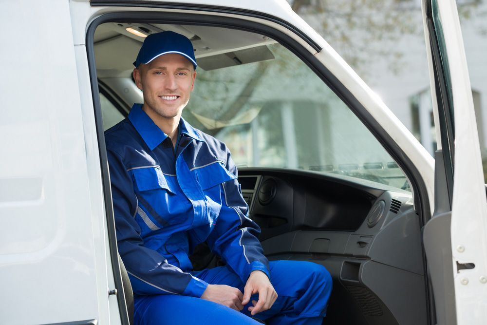 Man Sitting in the Driver's Seat of a Van — Uniforms2U in Campbelltown, NSW