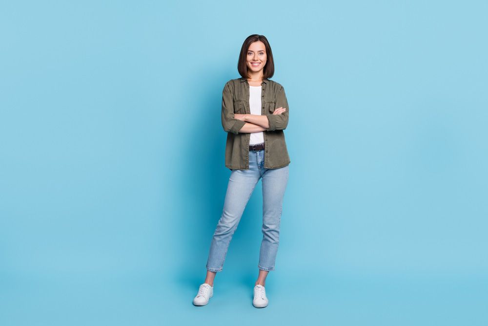 Woman Standing on a Blue Background — Uniforms2U in Penrith, NSW