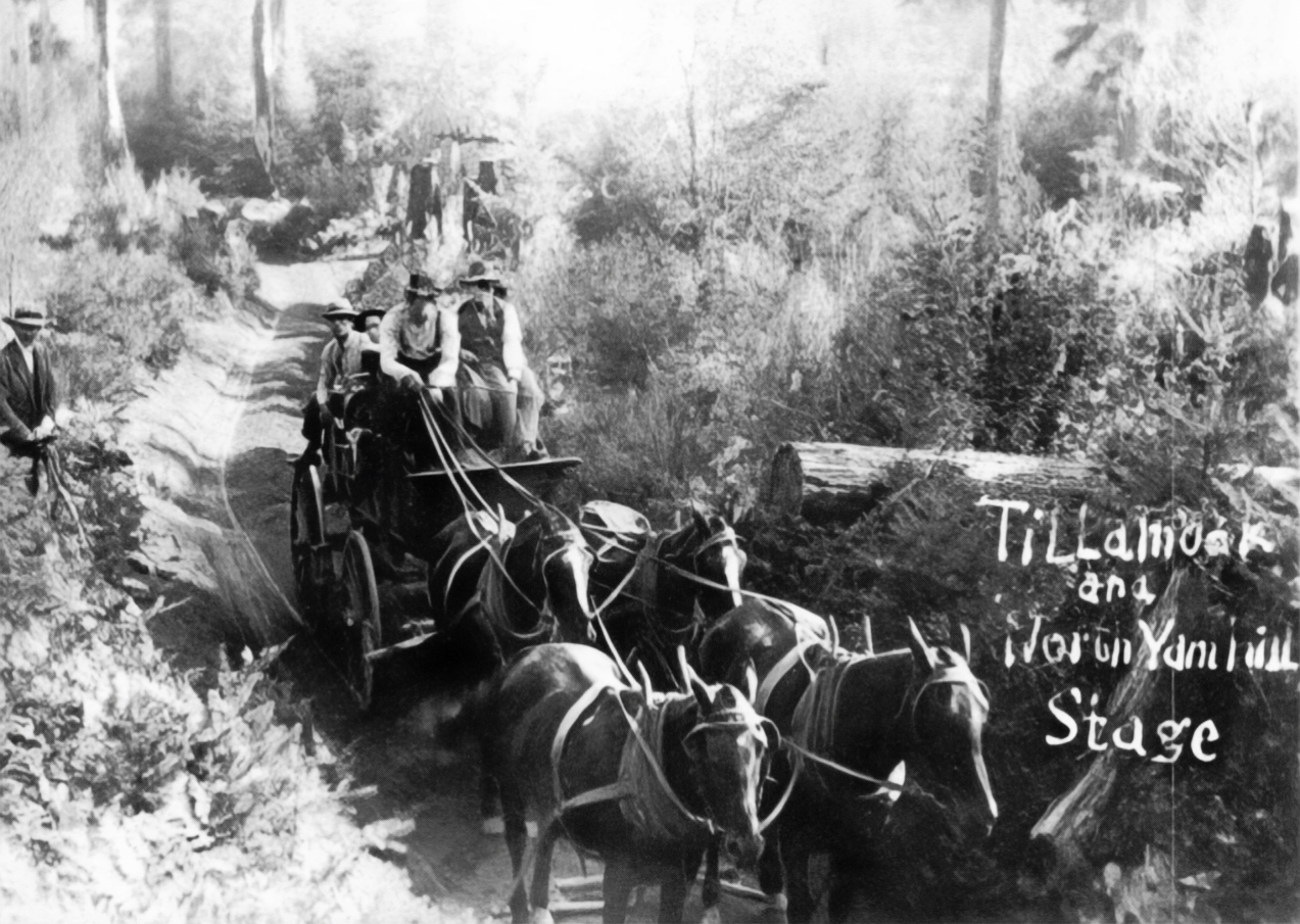 Horse-drawn stagecoach on a narrow mountain road, with passengers and wooded cliffs nearby.