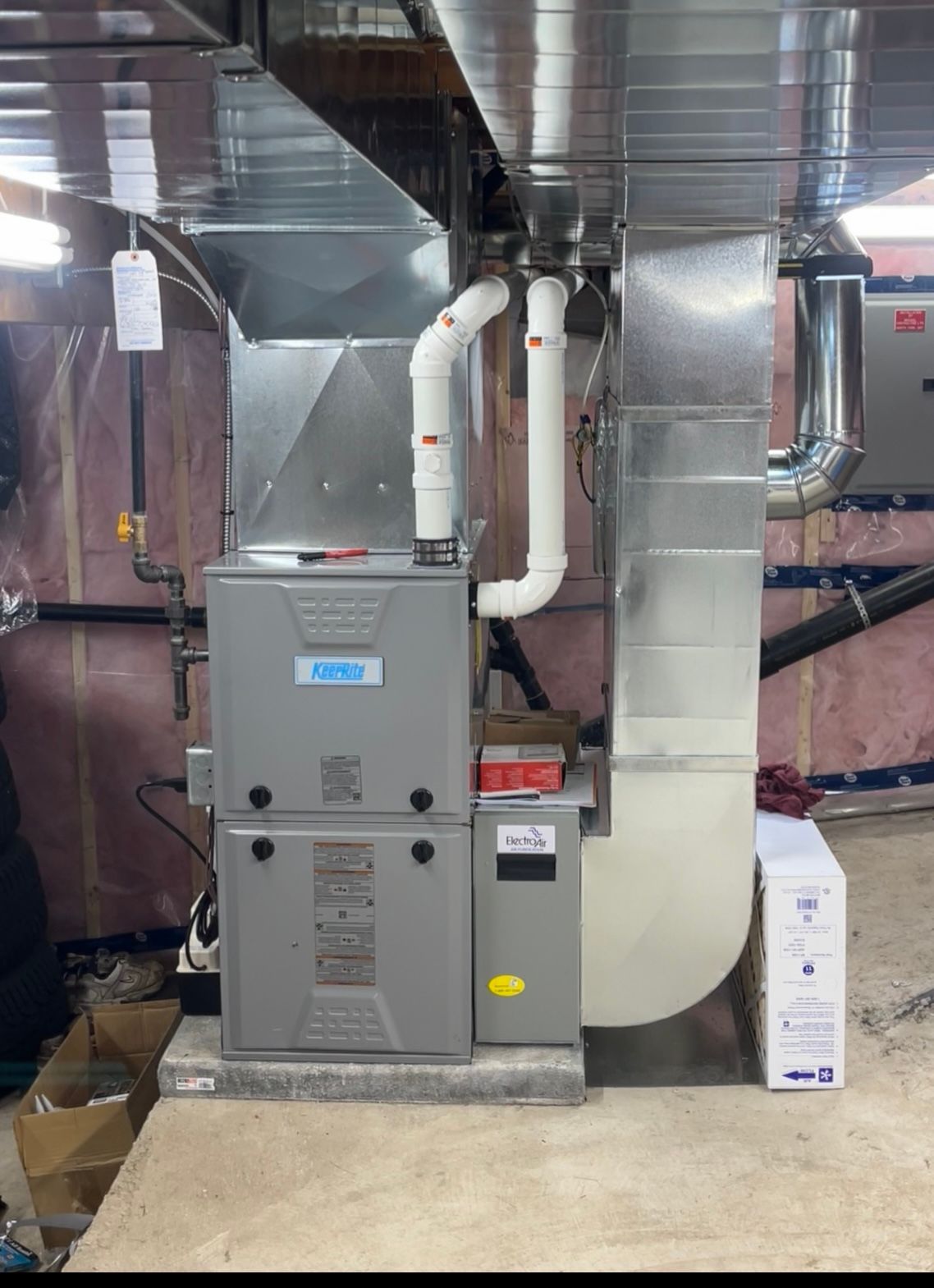 An air conditioner is installed in a basement in a house.