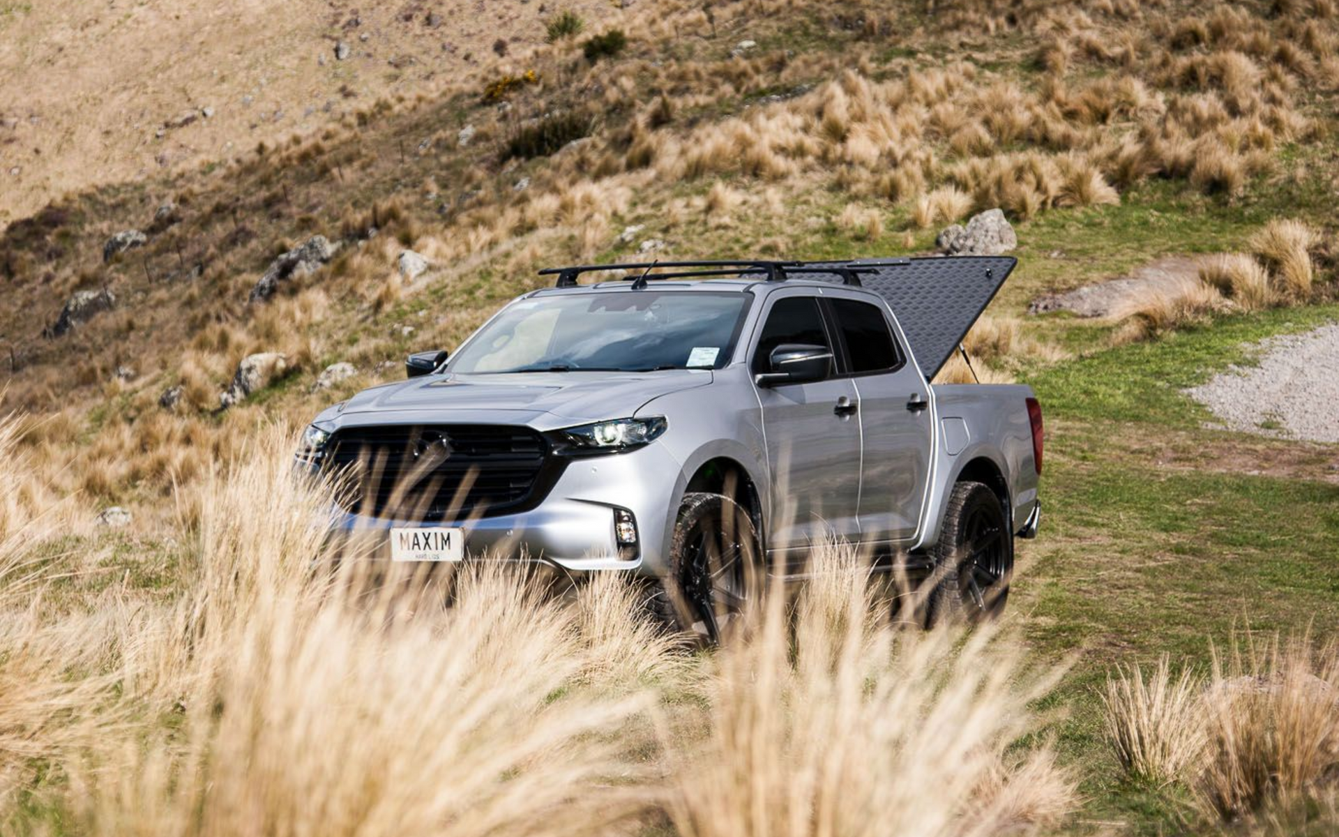 MAZDA BT-50 with MAXIM Hard Lid off road on a mountain