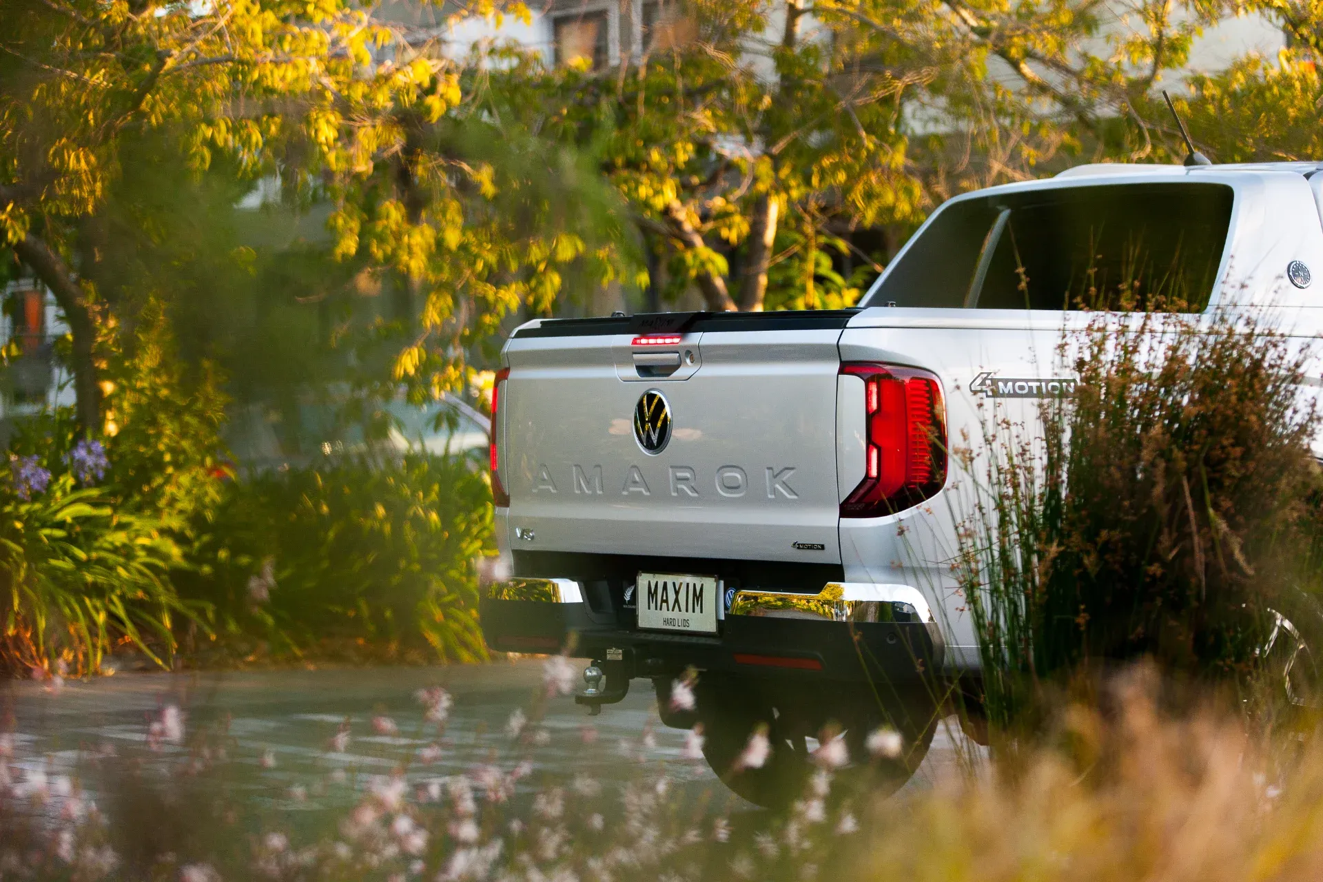 Volkeswagon Amarok with MAXIM Hard Lid in a garden.