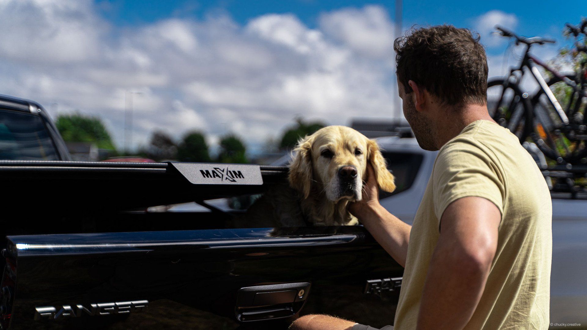 MAXIM Hard Lid with Dogs stays for Mans best friend.