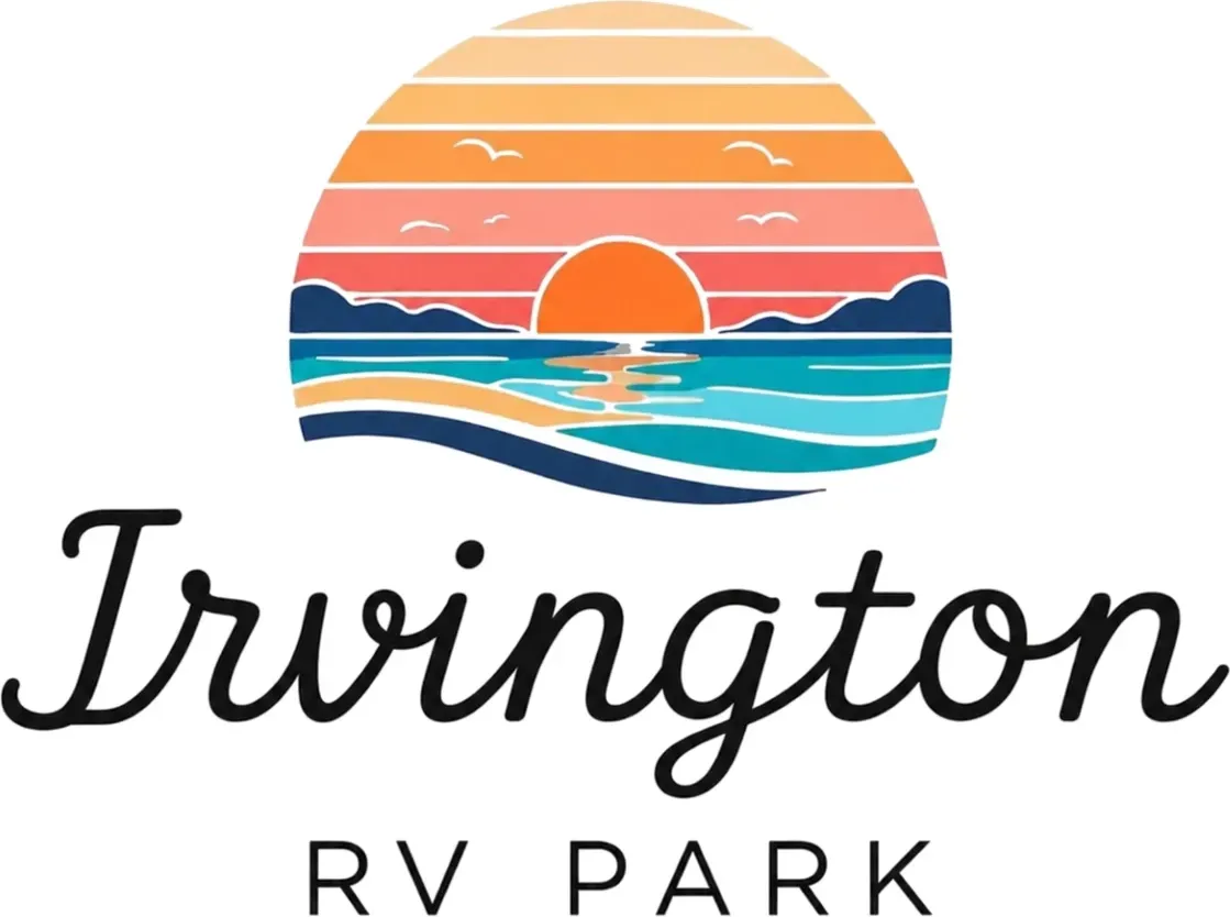 Irvington RV Park logo with sunset over ocean and waves in orange, blue, and teal