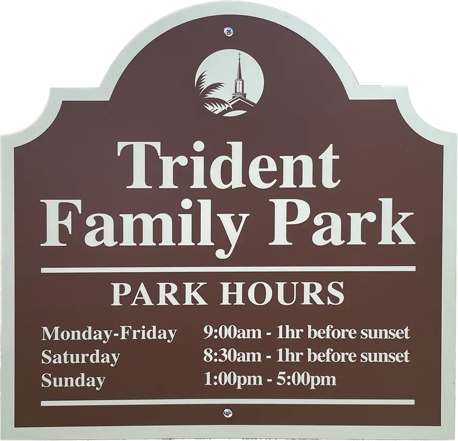 Sign for Trident Family Park. Brown background with white lettering. Lists park hours.