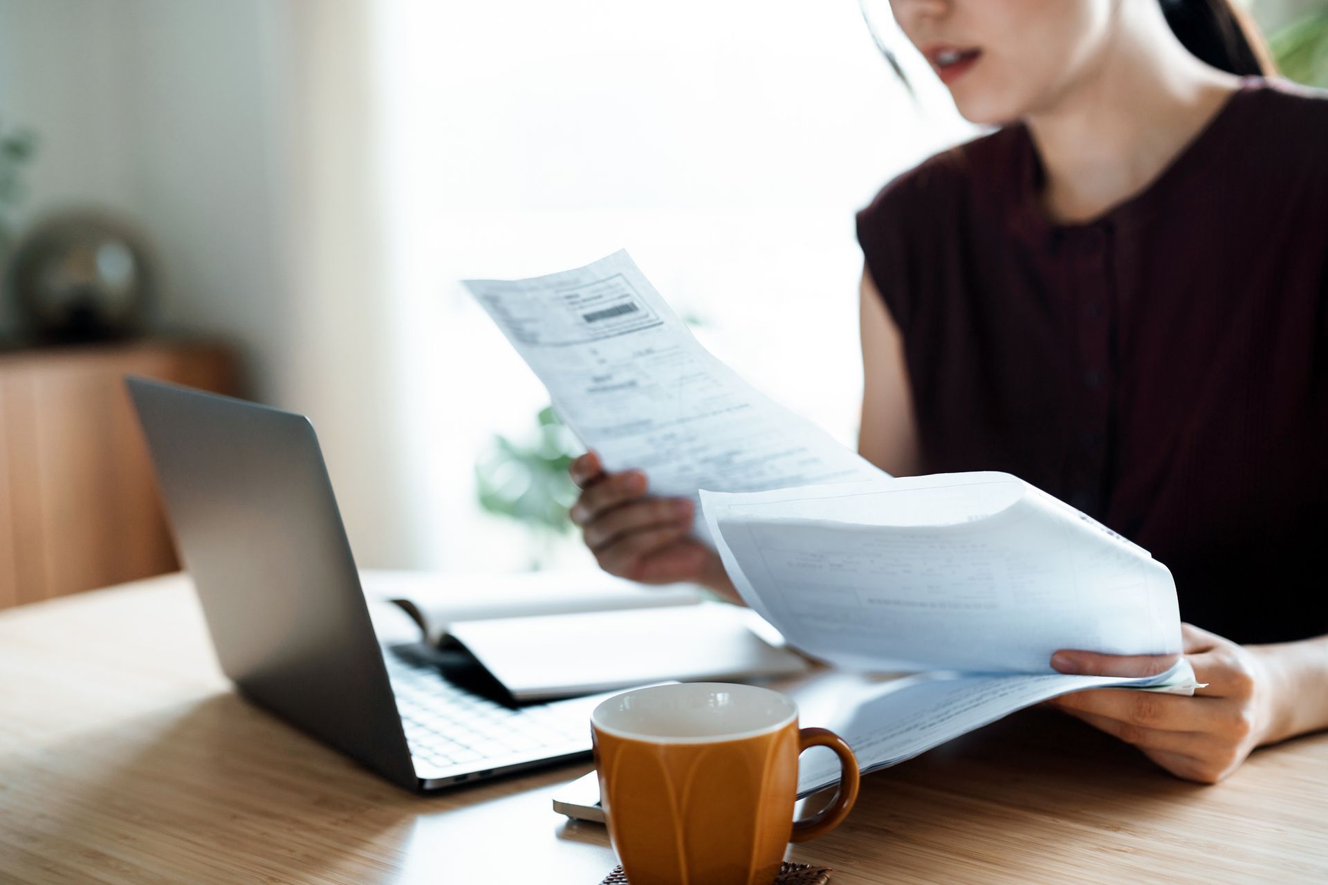 Female Financial Advisor Reviews Documents | Princeton, NJ | Hy Appelbaum CPA